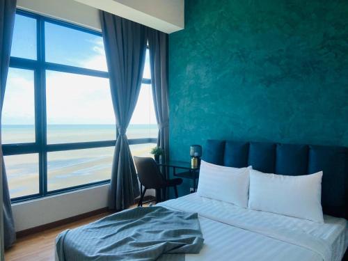 a bedroom with a bed and a large window at Kuantan Imperium by Glex in Kuantan