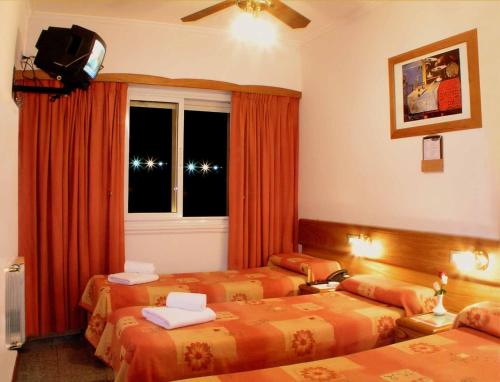 Llit o llits en una habitació de Gran Hotel Atlantic