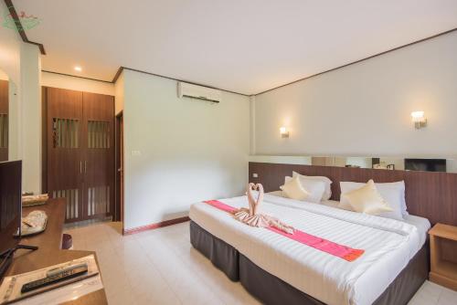 Voodi või voodid majutusasutuse Chai Chet Resort Koh Chang toas