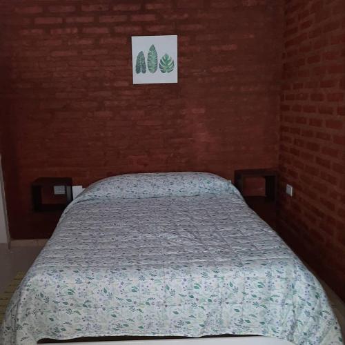 Ein Bett oder Betten in einem Zimmer der Unterkunft M&M Cipolletti