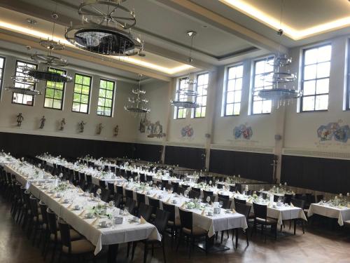 a banquet hall with tables set up for a wedding at Klosterbräuhaus Ursberg in Ursberg