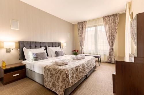 Posteľ alebo postele v izbe v ubytovaní Murite Park Hotel