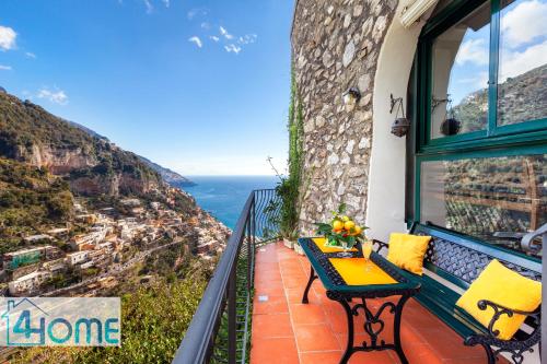 a balcony with a table and a view of the ocean at Estate4home - RELAXING POSITANO in Positano
