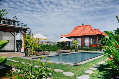 an image of a villa with a swimming pool at Japa Guesthouse in Canggu