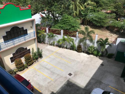 an overhead view of a parking lot next to a building at Southview Hotel in Dumaguete