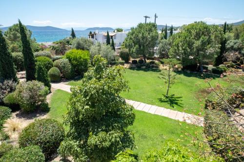 an aerial view of a garden with trees and bushes at 180 South Seaside Hotel in Thermisia