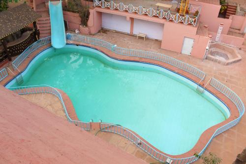 an overhead view of a swimming pool on top of a building at The Byke Brightland Adventure Park & Resort in Matheran