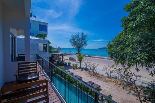 a balcony of a house with a view of the beach at Ren Resort in Sihanoukville