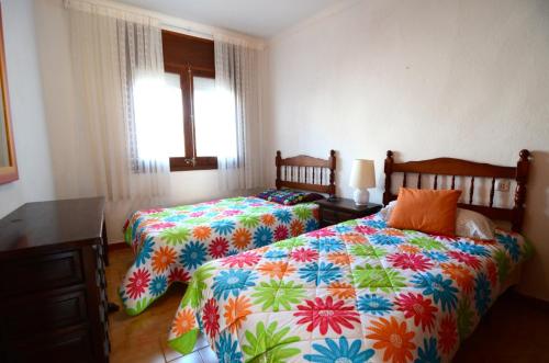 Postel nebo postele na pokoji v ubytování Llanca 2