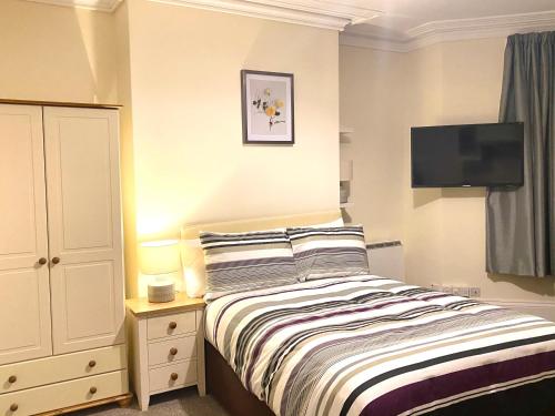 Katil atau katil-katil dalam bilik di Seaford Lodge Apartments