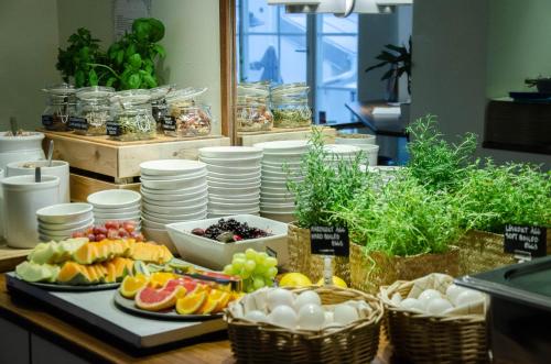 a buffet of fruits and vegetables on a table at Hotel Vanilla in Gothenburg