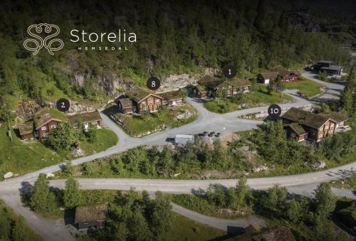 arial view of a village with a road and houses at Storelia in Hemsedal