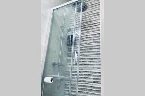 a shower with a glass door in a bathroom at NEW Apartamento Caleta,Relax, Pool, Terrace, Wifi in Caleta De Fuste