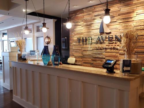 a bar with a sign that reads the agency at Avenue Inn & Spa in Rehoboth Beach