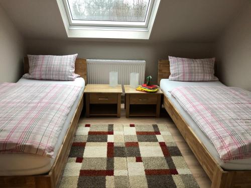 Postel nebo postele na pokoji v ubytování Ferienwohnung Zum Dütetal DG Apartment 2