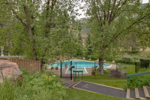 a black fence with a pool in a yard at Timber Falls 3/2 condo in E Vail 4480 Timber Falls Ct, #1504, Vail, CO 81657 in Vail