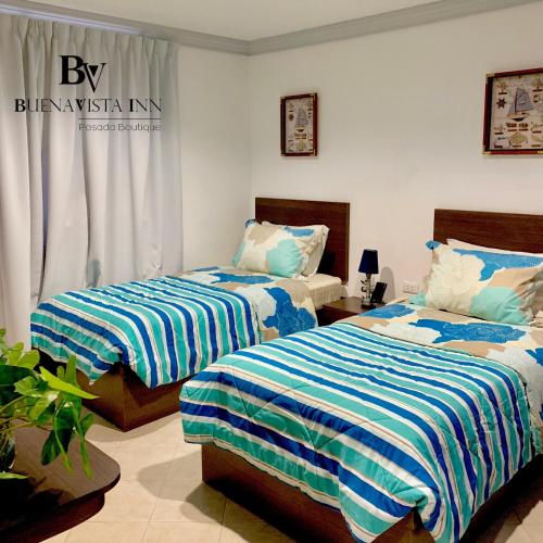 Ένα ή περισσότερα κρεβάτια σε δωμάτιο στο BUENAVISTA INN
