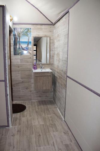 a bathroom with a sink and a mirror at WADI RUM STAR WARS CAMP in Wadi Rum