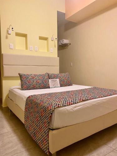 Cama o camas de una habitación en Hotel Arcoiris Tulum