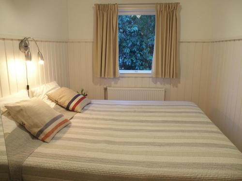 Postel nebo postele na pokoji v ubytování Vakantiehuis de Kanoet