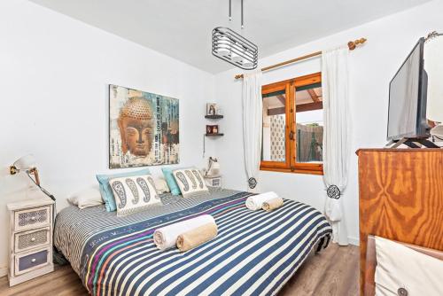 Ένα ή περισσότερα κρεβάτια σε δωμάτιο στο Ca L'avi i S'Avia - Punta Prima