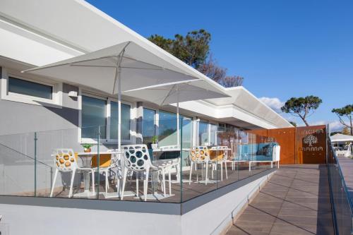 a balcony with tables and chairs on a building at Pachamama in Boscotrecase