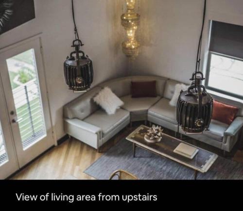 a living room with a couch and a table at Bishop Arts Hotel in Dallas
