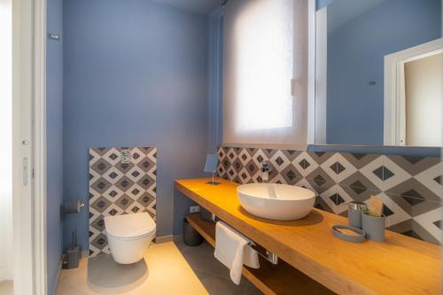 a bathroom with a sink and a toilet at Casa Angelina in Marsala
