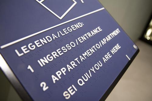 a blue sign with the words internationalisation and aryan immigration at Casa Angelina in Marsala