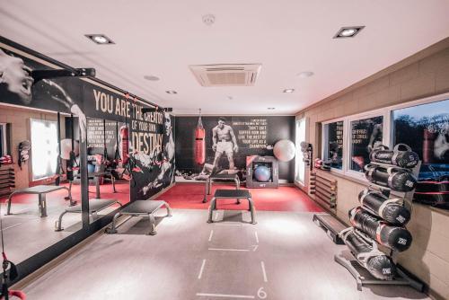 a room with a gym with boxing equipment at Bowfield Hotel and Spa in Howwood