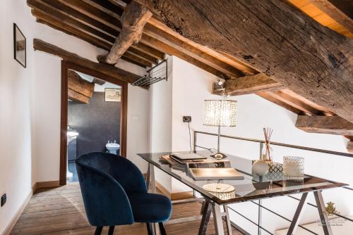 an office with a desk and a chair at Villa Guinigi Dimora di Epoca Exclusive Residence & Pool in Lucca