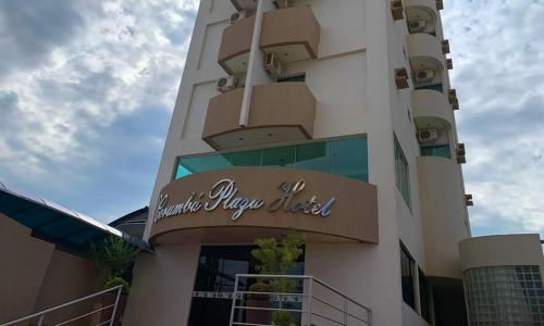 a building with a sign on the side of it at Corumbá Plaza Hotel in Luziânia