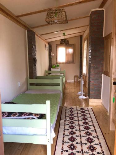 Una cama o camas en una habitación de Salaš Gnijezdo