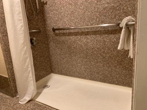 a shower with a glass door with a shower at Quality Inn Temecula Valley Wine Country in Temecula