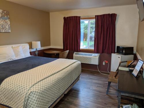 Postel nebo postele na pokoji v ubytování Hillcrest Inn