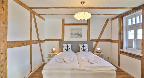 Postel nebo postele na pokoji v ubytování Mühlenhaus Wassermühle