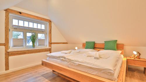 Ένα ή περισσότερα κρεβάτια σε δωμάτιο στο Mühlenhaus Windmühle