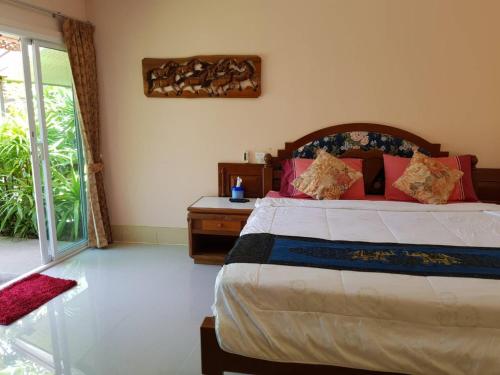 Postel nebo postele na pokoji v ubytování Discovery House Hotel SHA Plus
