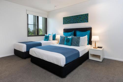 Giường trong phòng chung tại Saltwater Suites - Waterfront Apartments
