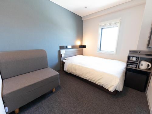 Postel nebo postele na pokoji v ubytování Super Hotel Ishikawa Nomineagari Smart Inter