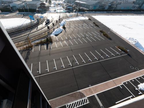 a parking lot with a bunch of empty seats at Super Hotel Ishikawa Nomineagari Smart Inter in Nomi