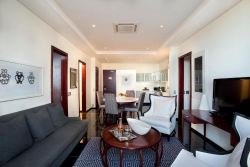 a living room with a couch and a table at DAVINCI Suites in Johannesburg