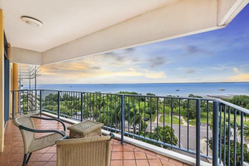 a balcony with a view of the ocean at ZEN AT THE ESPLANADE - Spectacular Sunset Retreat in Darwin