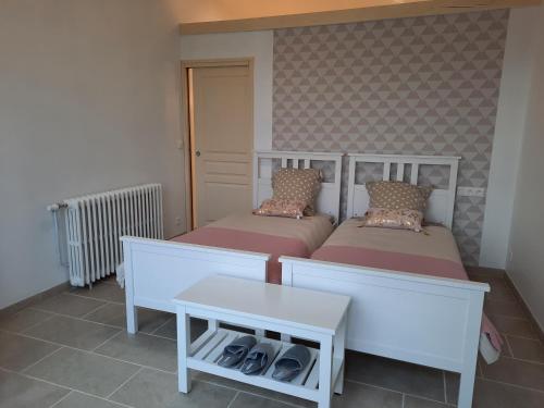 Кровать или кровати в номере Villa du Cerf Thibault