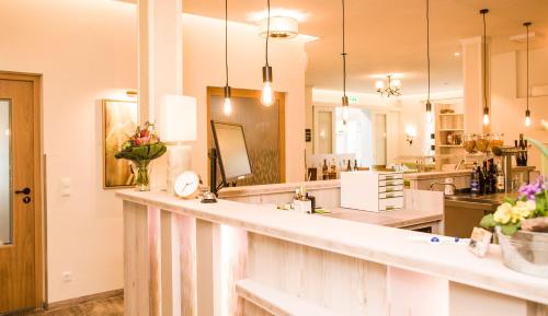 a large kitchen with a large white counter top at Lindenhaus Scharfe Kurve in Rosenow