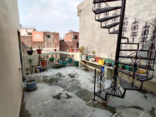 a balcony with a staircase on top of a building at Vrinda Apartments in Amritsar