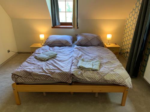 Postel nebo postele na pokoji v ubytování Chalet Jizerky