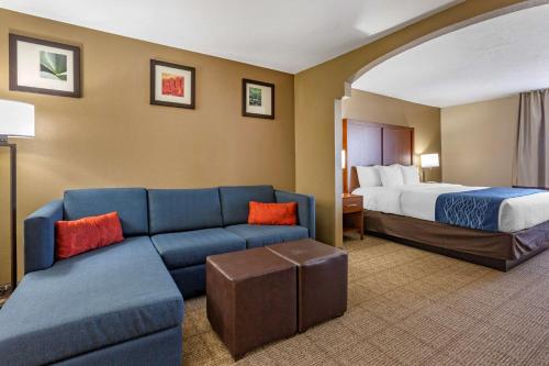 a hotel room with a couch and a bed at Comfort Inn & Suites Lordsburg I-10 in Lordsburg
