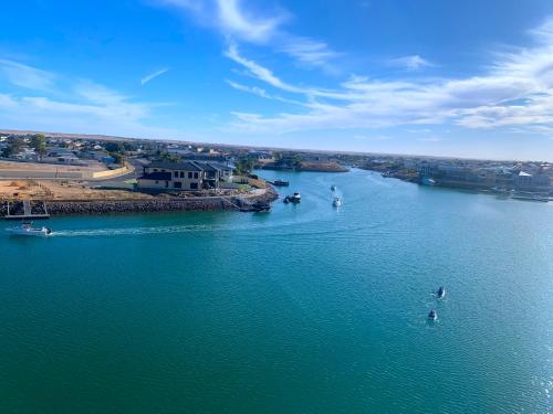 an aerial view of a river with boats in it at Wallaroo Marina Luxury Apartment in Wallaroo