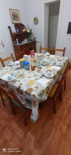a dining room table with a table cloth on it at Casa Cristina in Siracusa